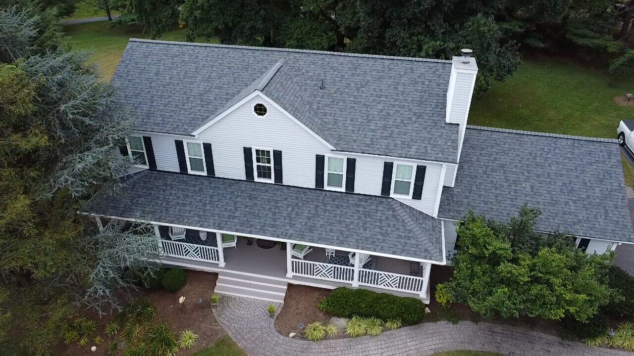 Aerial view of a large, white house.
