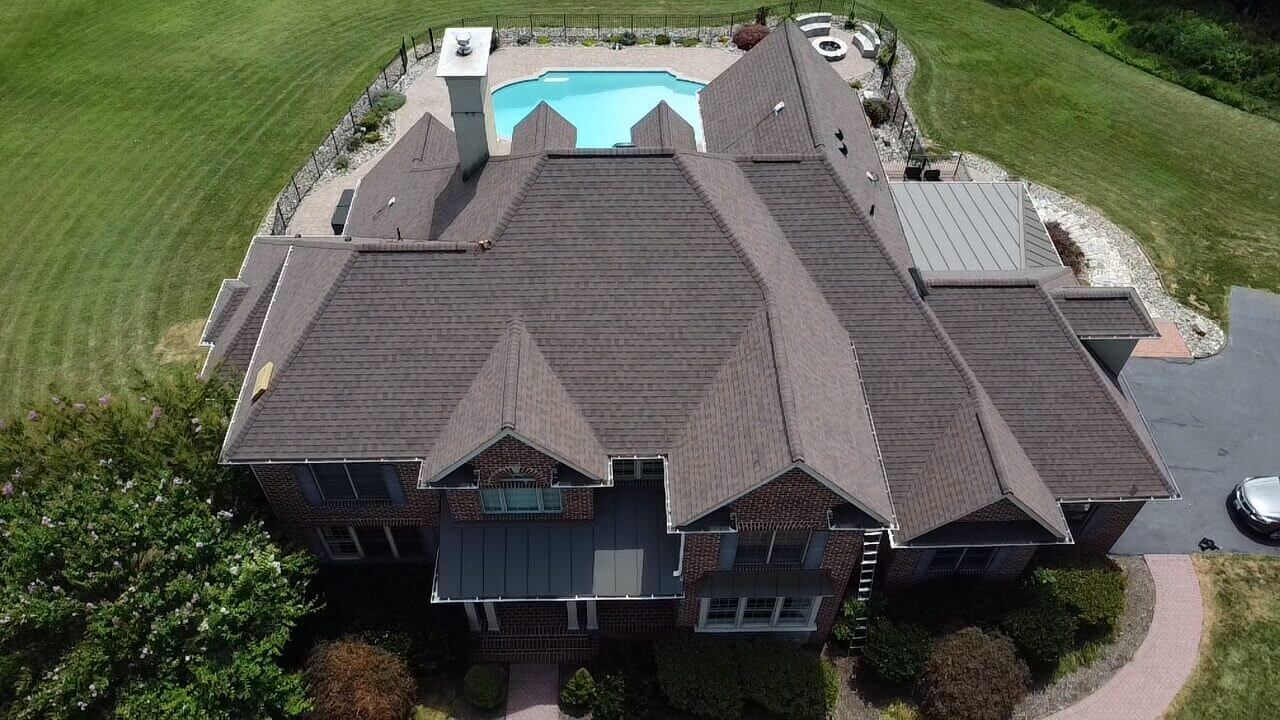 Aerial view of large house with swimming pool